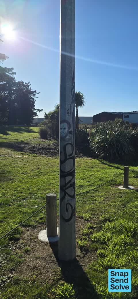 Graffiti on a traffic light pole or cabinet, or wa, a report photo