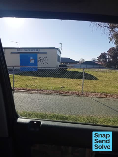 Graffiti on a traffic light pole or cabinet, or wa — a report photo
