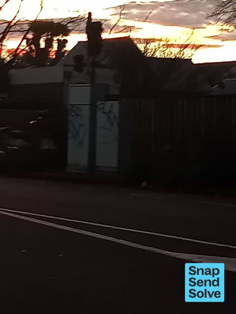 Graffiti on a traffic light pole or cabinet, or wa — a report photo
