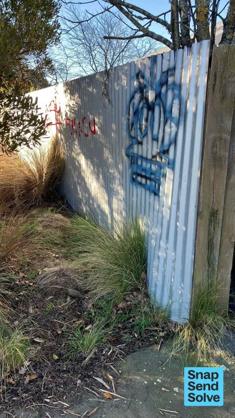 Graffiti on a fence, building or structure, a report photo