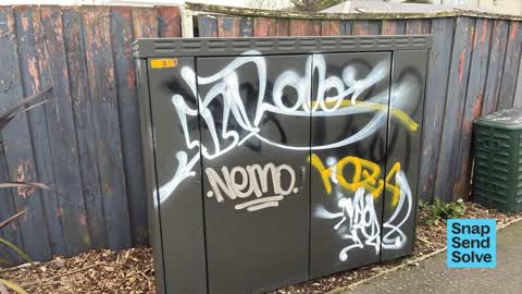 Graffiti on a traffic light pole or cabinet, or wa, a report photo