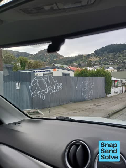 Graffiti on a fence, building or structure, a report photo