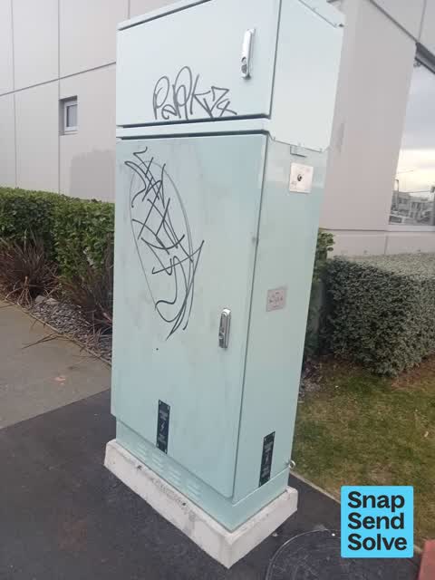 Graffiti on a traffic light pole or cabinet, or wa — a report photo