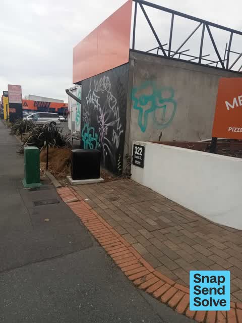 Graffiti on a fence, building or structure — a report photo