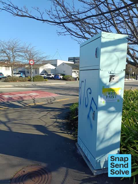 Graffiti on a traffic light pole or cabinet, or wa, a report photo