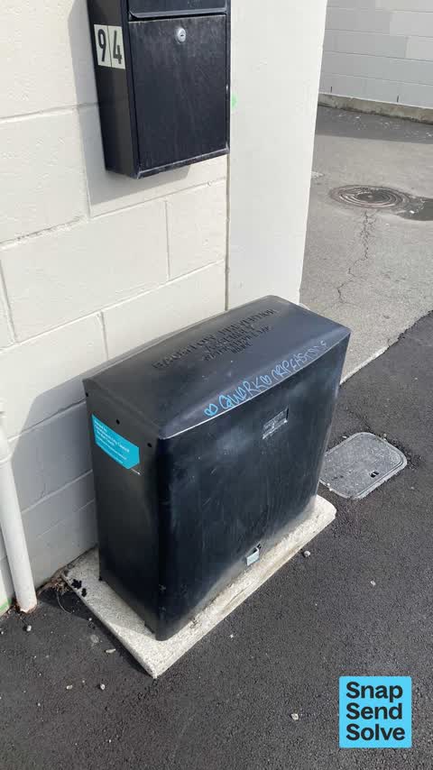 Graffiti on a traffic light pole or cabinet, or wa, a report photo