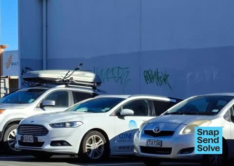 Graffiti on a fence, building or structure, a report photo