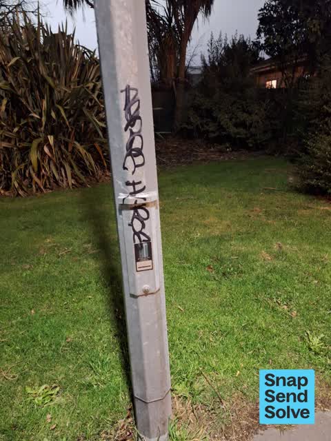 Graffiti on a traffic light pole or cabinet, or wa, a report photo