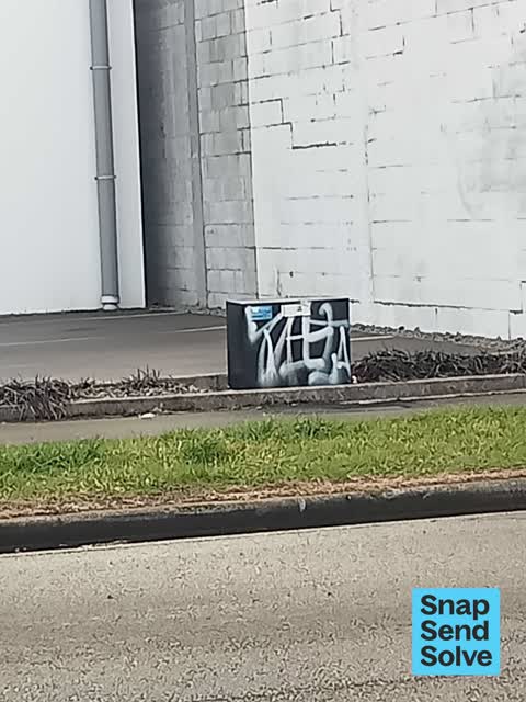 Graffiti on a fence, building or structure, a report photo