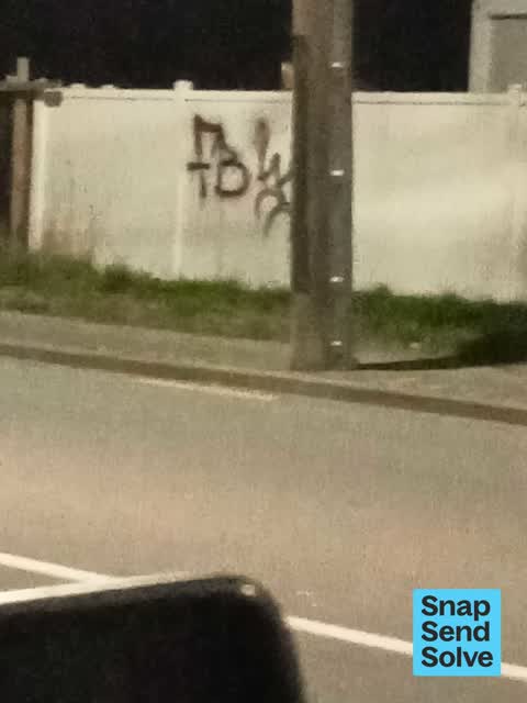 Graffiti on a fence, building or structure, a report photo