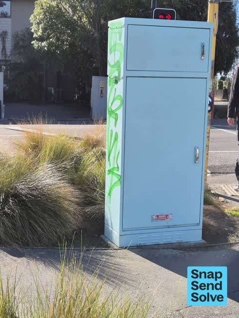 Graffiti on a traffic light pole or cabinet, or wa — a report photo