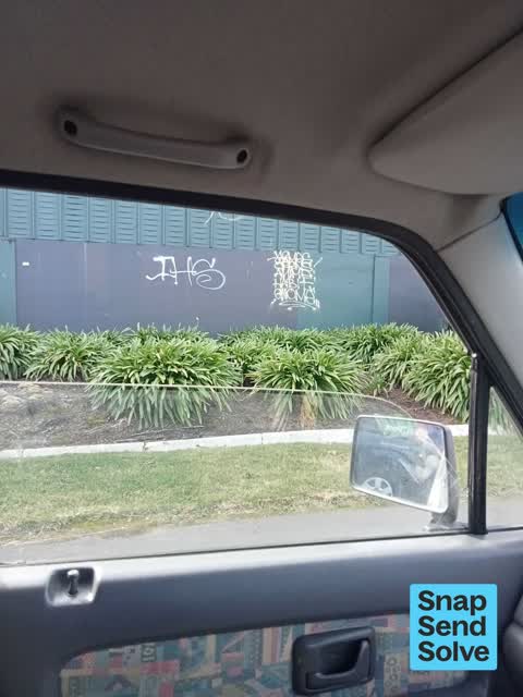 Graffiti on a fence, building or structure, a report photo