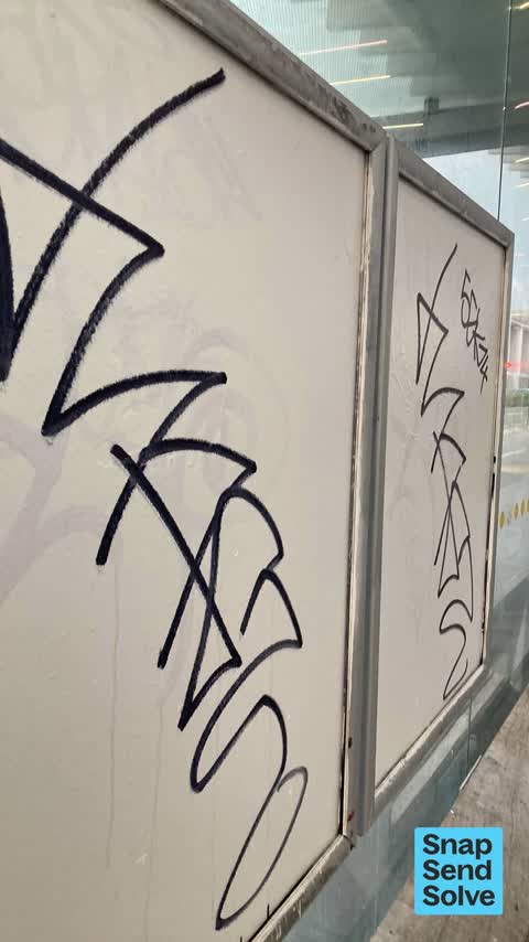 Graffiti on a bus stop or public toilet, a report photo