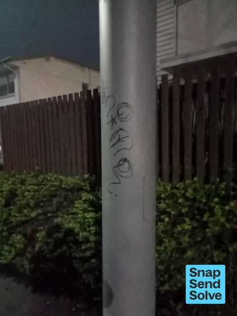 Graffiti on a fence, building or structure, a report photo