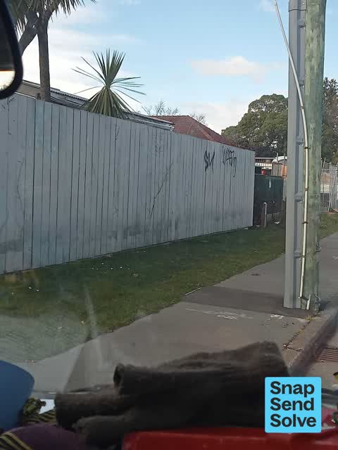 Graffiti on a fence, building or structure, a report photo