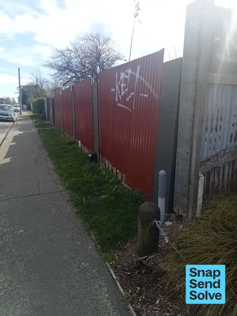 Graffiti on a fence, building or structure, a report photo