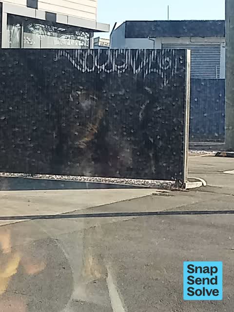 Graffiti on a fence, building or structure, a report photo