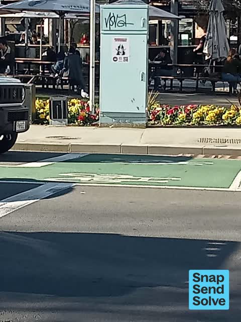 Graffiti on a traffic light pole or cabinet, or wa — a report photo