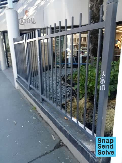 Graffiti on a fence, building or structure, a report photo