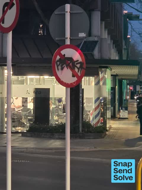 Graffiti on a sign, mural or public art, a report photo