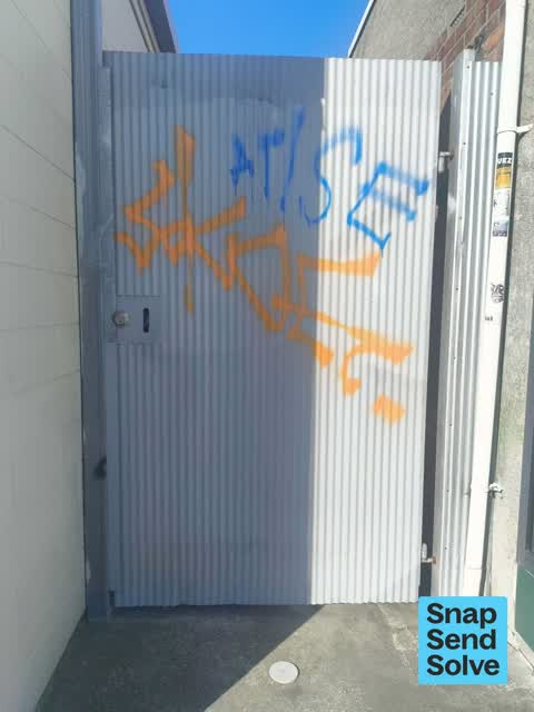 Graffiti on a fence, building or structure — a report photo