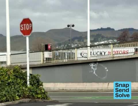 Graffiti on a road, footpath or bridge, a report photo