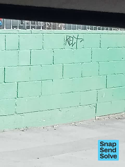 Graffiti on a fence, building or structure, a report photo