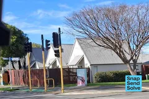 Graffiti on a traffic light pole or cabinet, or wa — a report photo