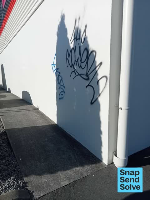 Graffiti on a fence, building or structure, a report photo