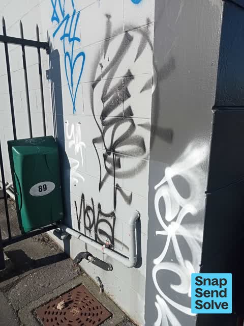 Graffiti on a fence, building or structure, a report photo