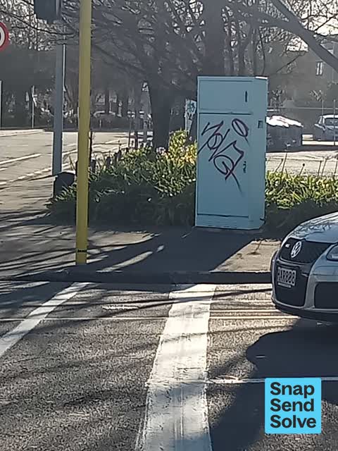 Graffiti on a traffic light pole or cabinet, or wa, a report photo