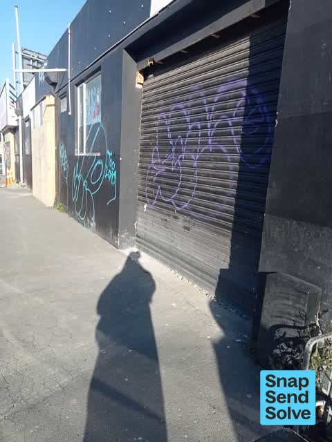 Graffiti on a fence, building or structure — a report photo