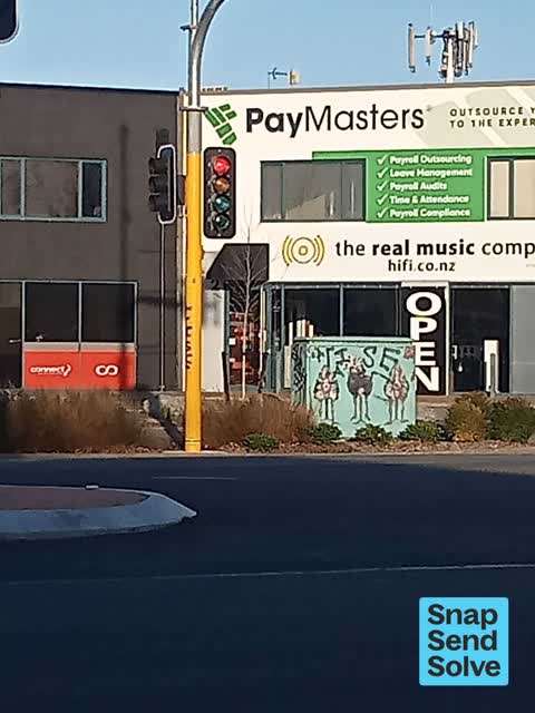 Graffiti on a traffic light pole or cabinet, or wa — a report photo