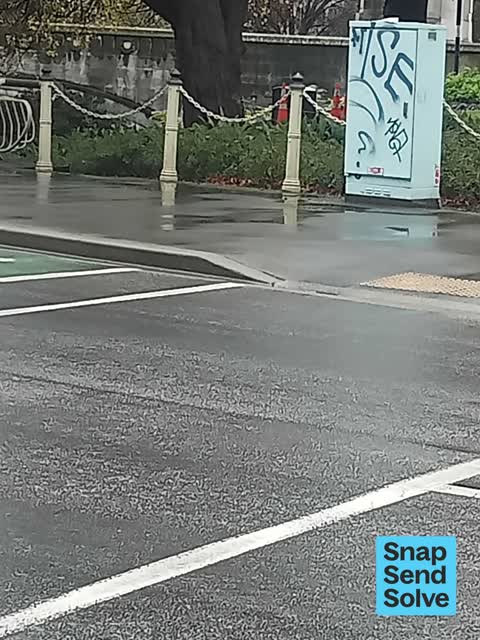 Graffiti on a traffic light pole or cabinet, or wa — a report photo