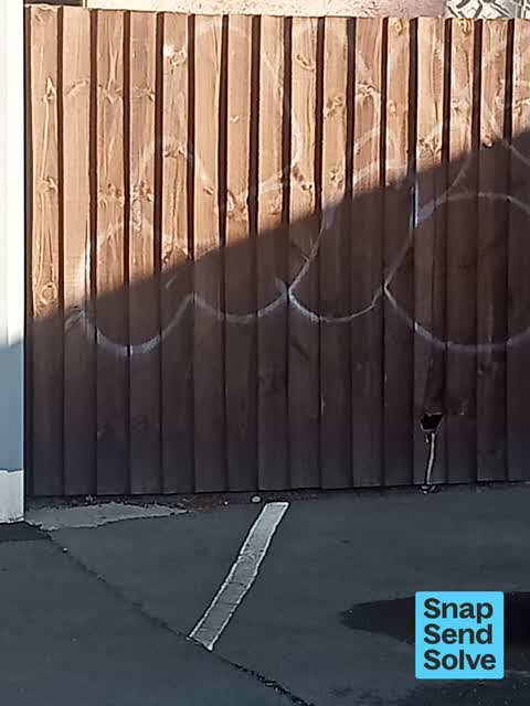 Graffiti on a fence, building or structure, a report photo