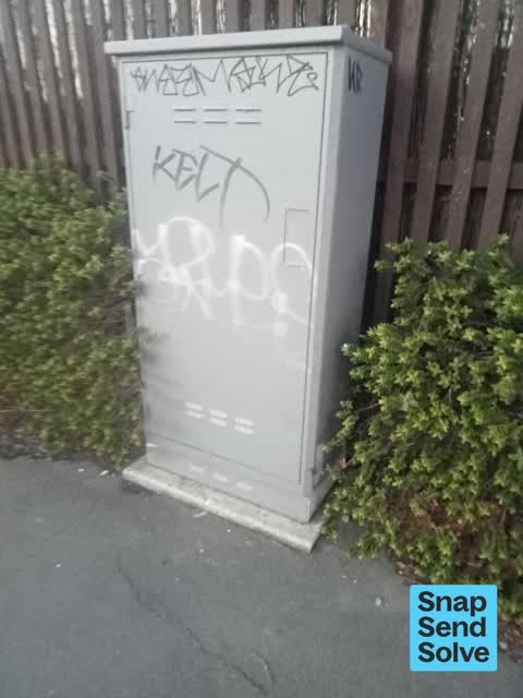 Graffiti on a traffic light pole or cabinet, or wa, a report photo