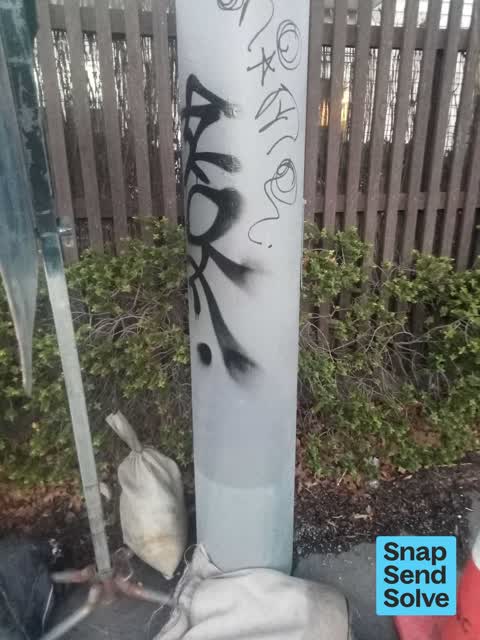 Graffiti on a fence, building or structure, a report photo