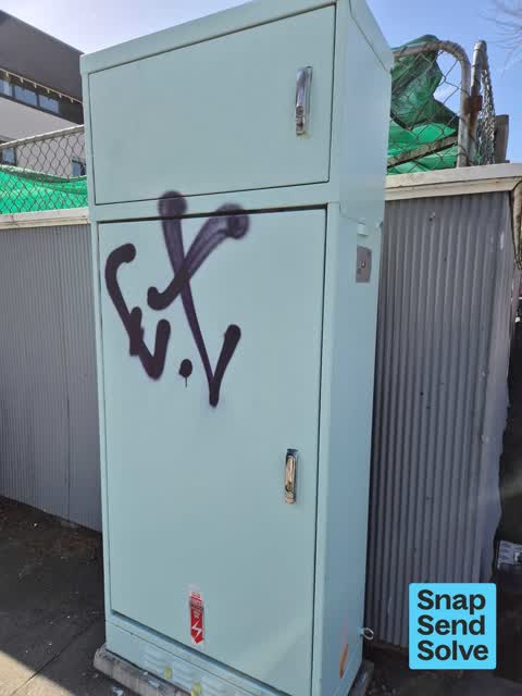 Graffiti on a traffic light pole or cabinet, or wa, a report photo