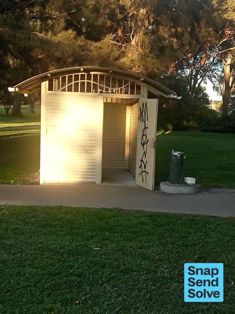 Graffiti on a bus stop or public toilet, a report photo