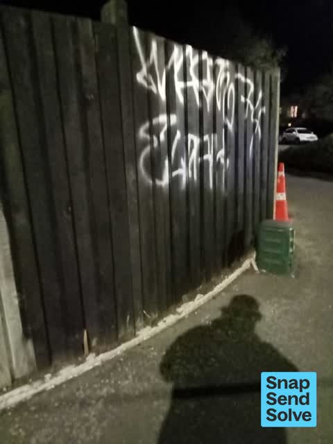 Graffiti on a fence, building or structure, a report photo