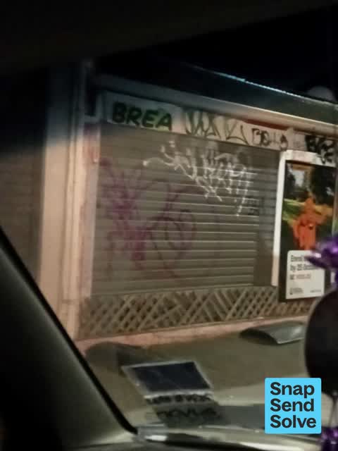 Graffiti on a fence, building or structure, a report photo