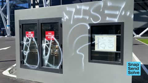 Graffiti on a fence, building or structure, a report photo
