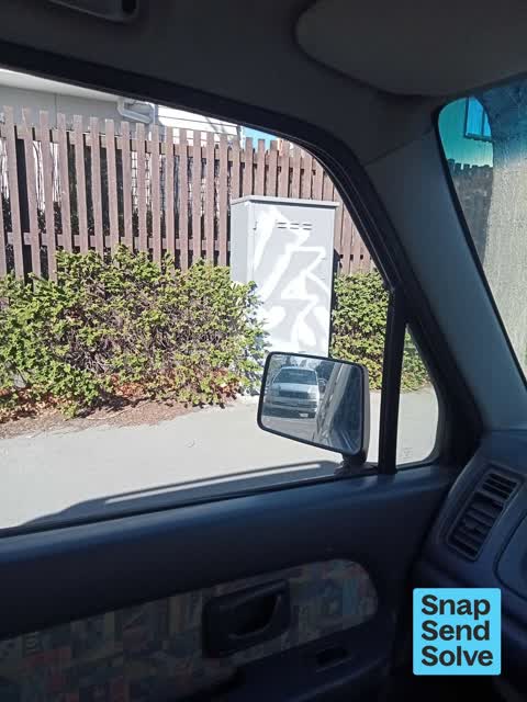 Graffiti on a traffic light pole or cabinet, or wa, a report photo