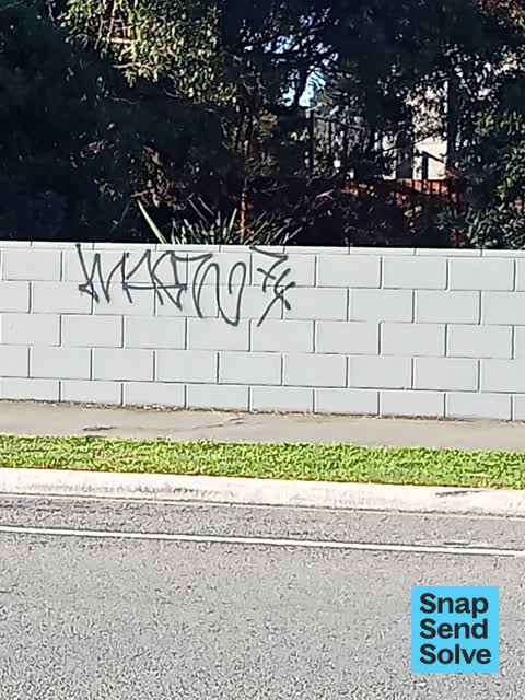 Graffiti on a fence, building or structure — a report photo