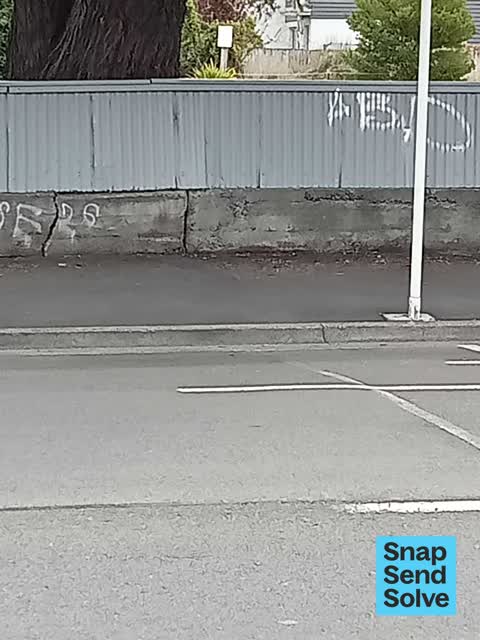 Graffiti on a fence, building or structure — a report photo
