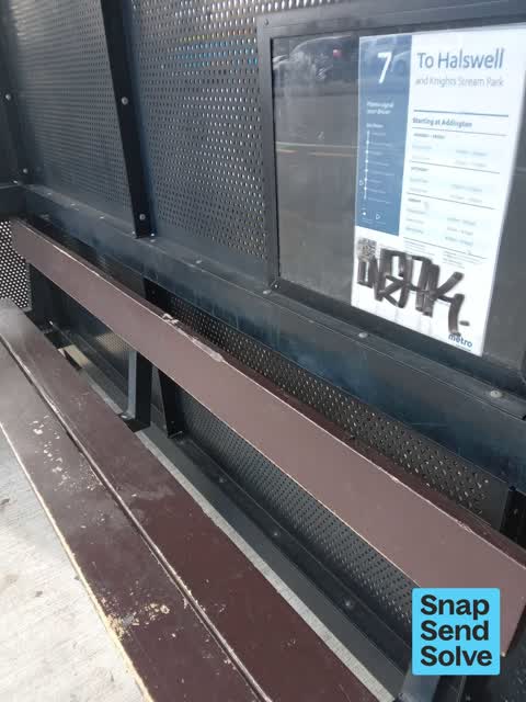 Graffiti on a bus stop or public toilet, a report photo