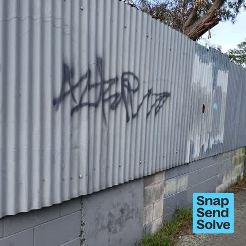 Graffiti on a fence, building or structure — a report photo