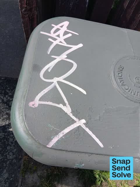 Graffiti on a traffic light pole or cabinet, or wa — a report photo