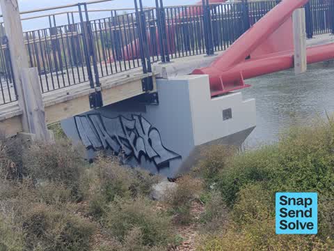 Graffiti on a road, footpath or bridge — a report photo