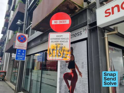 Graffiti on a sign, mural or public art, a report photo